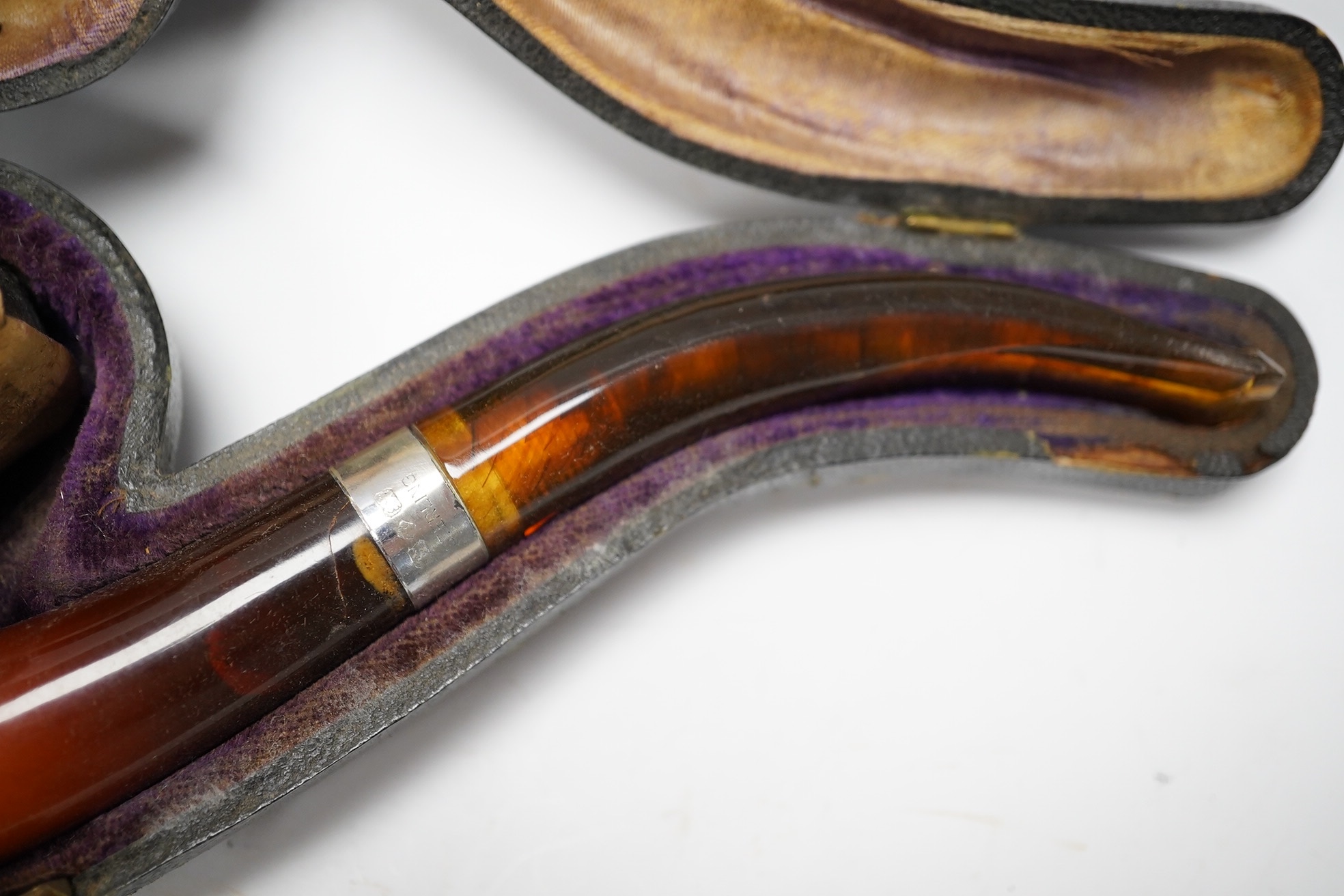 Three cased assorted Meerschaum pipes; sailor, boy on a pole and a Turk, largest Turk 19cm long. Condition - all pipes have damage either in pipe bowls or amber, cases worn